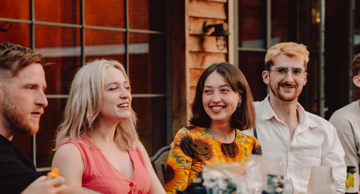 People Talking At Table