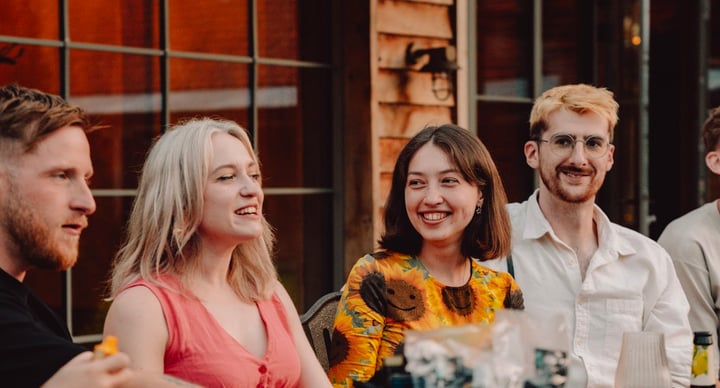 People Talking At Table