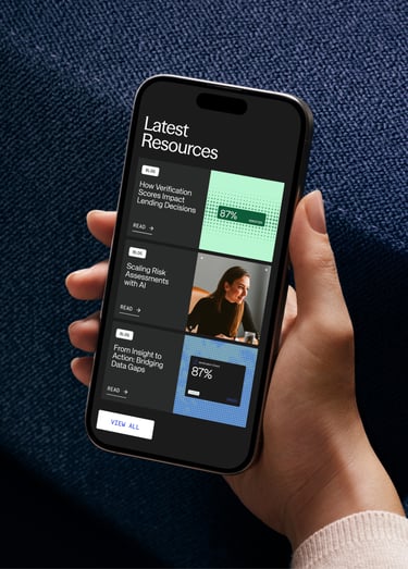 A smartphone displaying a “Latest Resources” section with blog cards, including article titles, preview images and a button to view all resources.