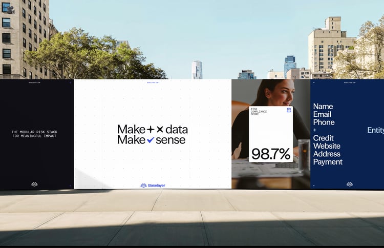 A series of Baselayer posters displayed outdoors, featuring messages about risk, data and compliance, including phrases like “Make data make sense” and a graphic showing a 98.7% compliance score.